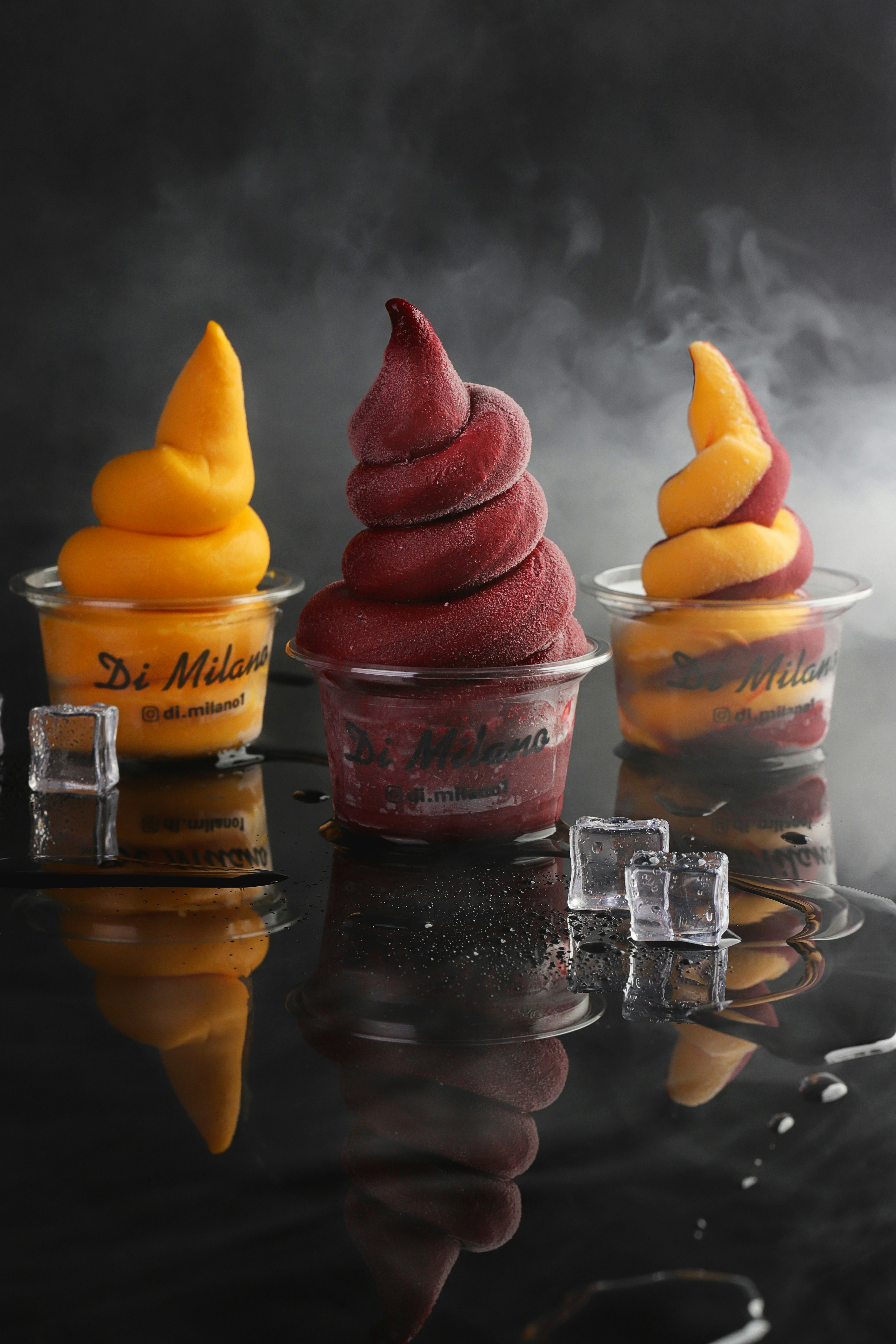 three ice creams on clear glass cups